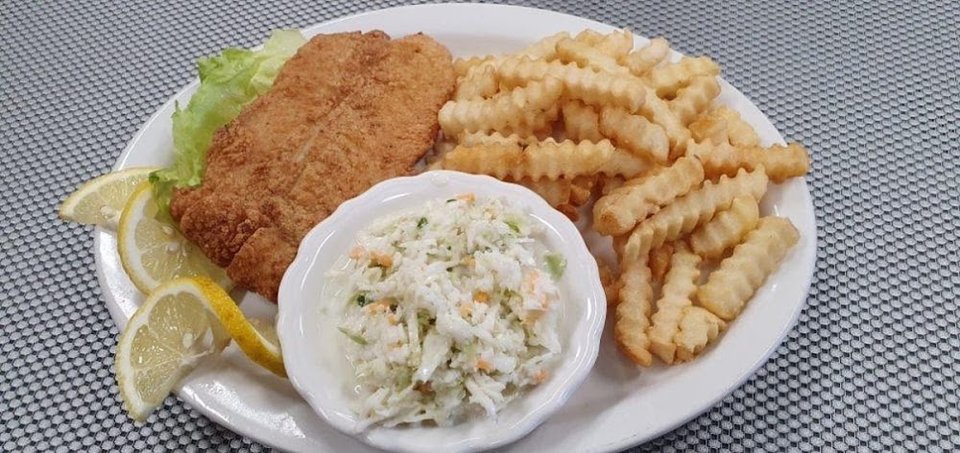 Printed diner menu with salads and sides.